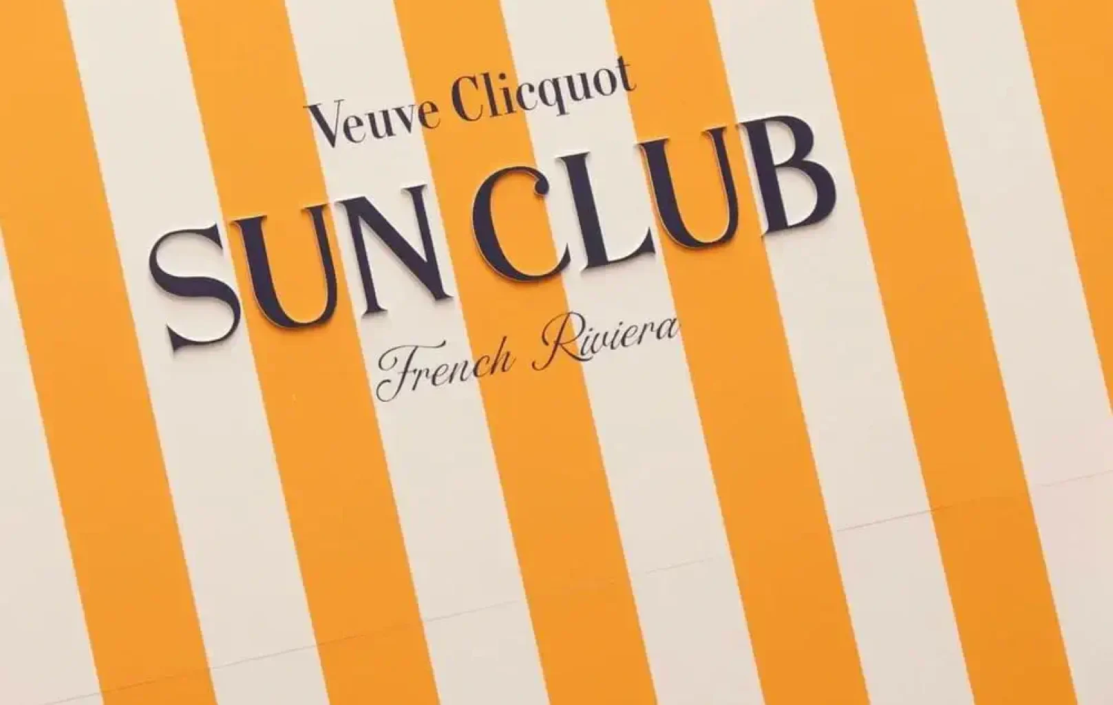 Yellow and white vertical stripes with the text "Veuve Clicquot SUN CLUB TERRACE French Riviera" printed in black and cursive font.